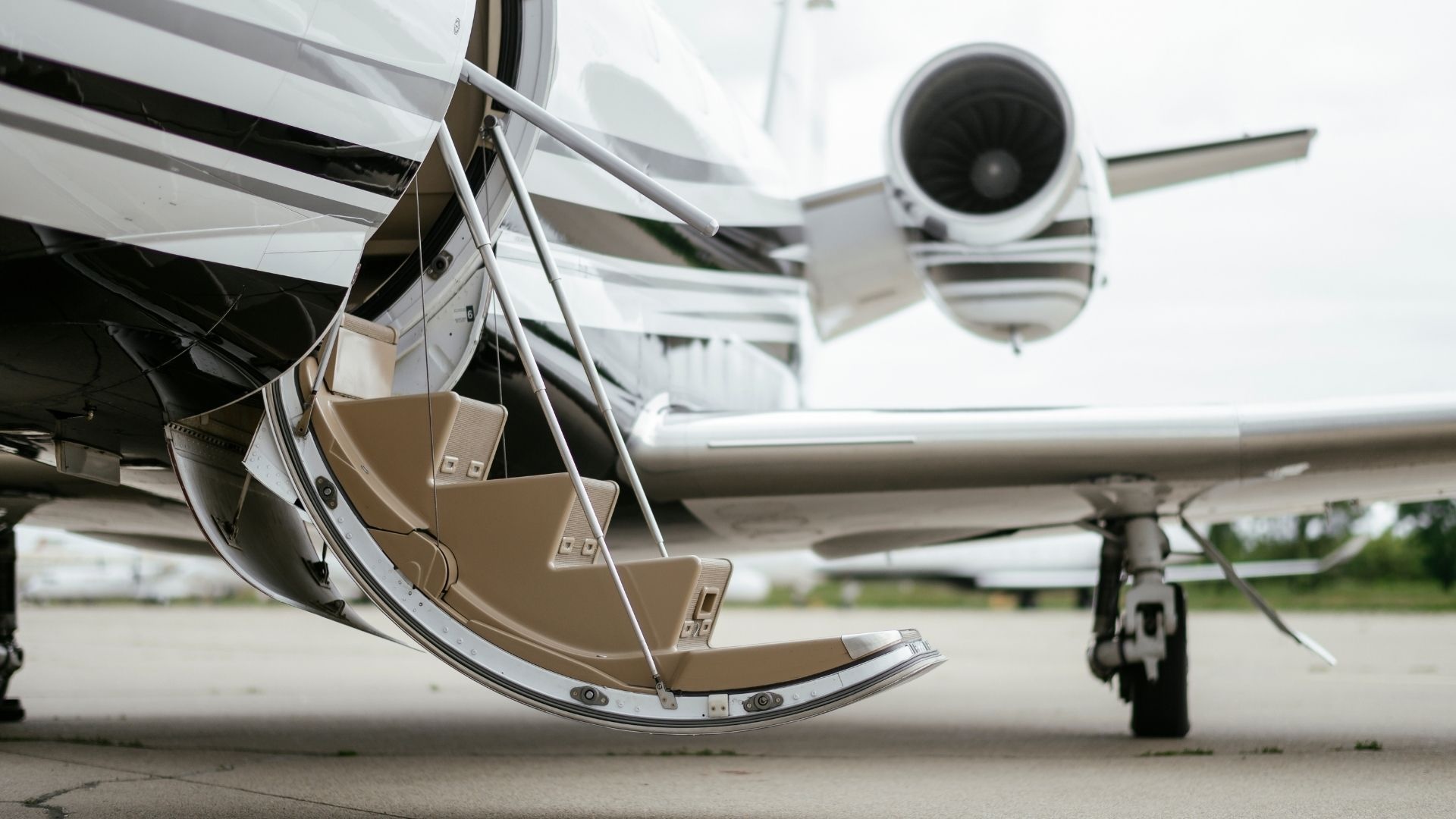Chauffeur assisting a traveler with luggage at Newark Liberty International Airport (EWR)